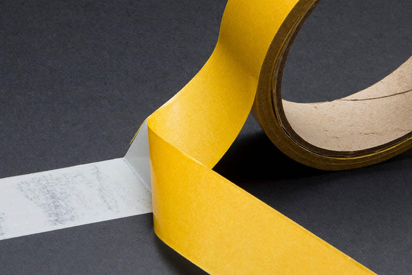ADHESIVE TAPE definition and meaning